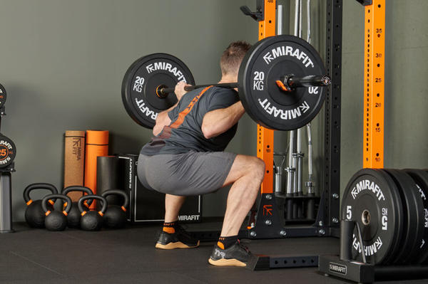 7 Trainer-Approved Workouts to Build Muscle Fast 4 Barbell Squats